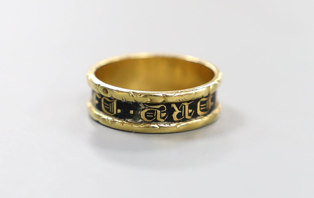 A late George IV 18ct gold and black enamel set mourning band, inscribed 'In Memory Of', shank hallmarked for Birmingham, 1829, size K/L, gross weight 3.2 grams.